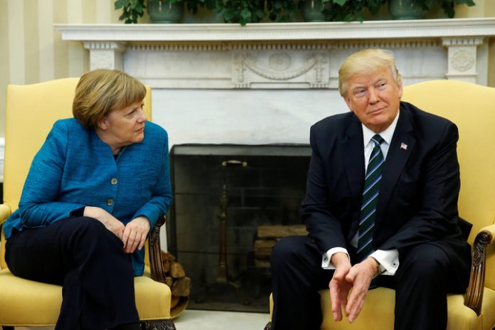 Trump meets with Merkel in the Oval Office at the White House in Washington