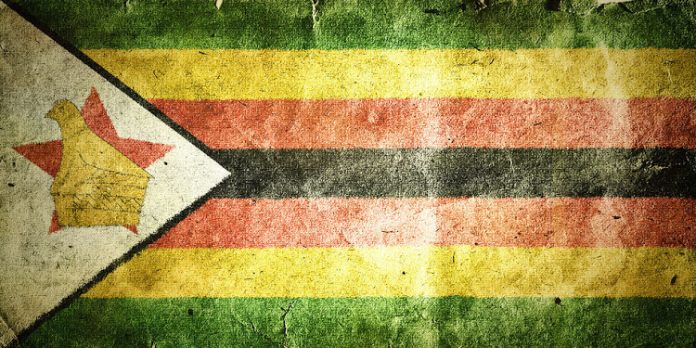 35174323 - flag of zimbabwe. old vintage paper texture.