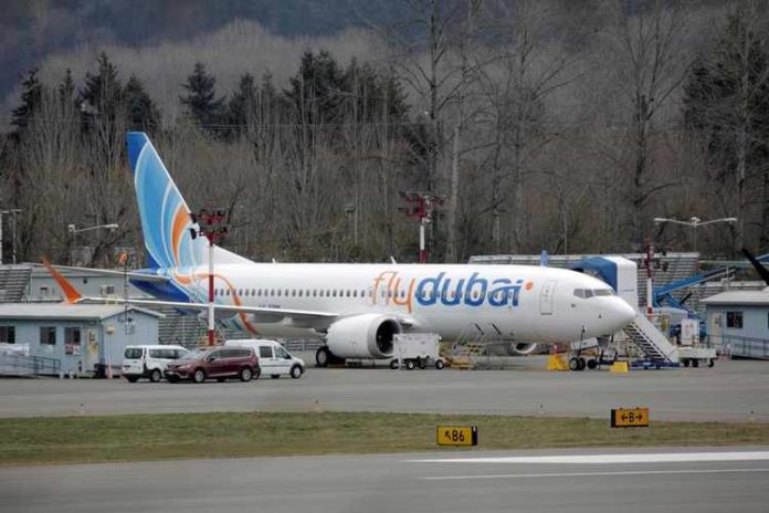 A Boeing 737 MAX aircraft bearing the logo of flydubai is parked at a Boeing production facility in Renton