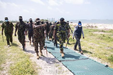 Chief of Defence Forces (CDF) Gen Robert Kibochi guides President Uhuru Kenyatta and Defence CS Dr Monica Juma in a tour
